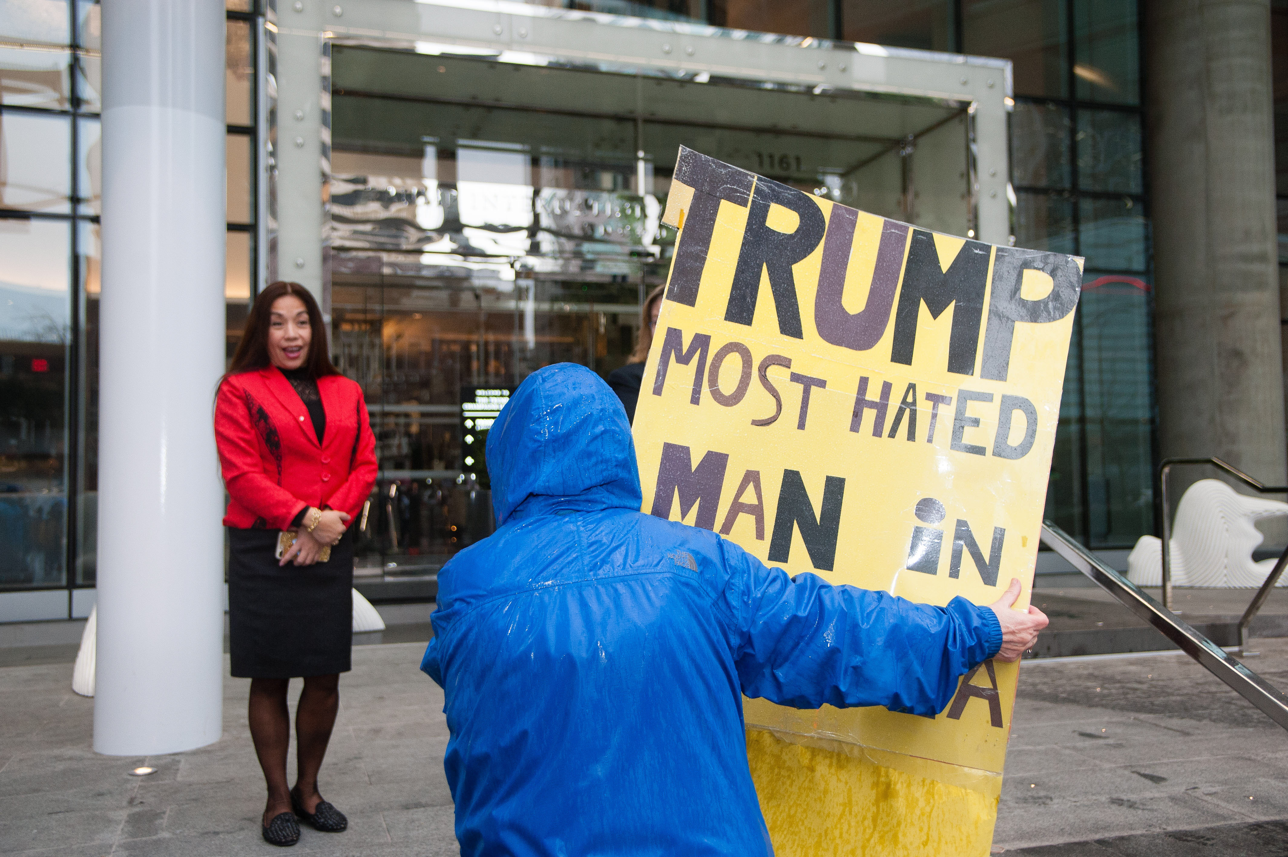 A Trump Tower patron argues with demonstrators.
